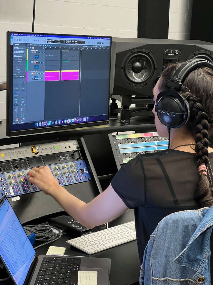 Architecture students learning podcast recording workflow
